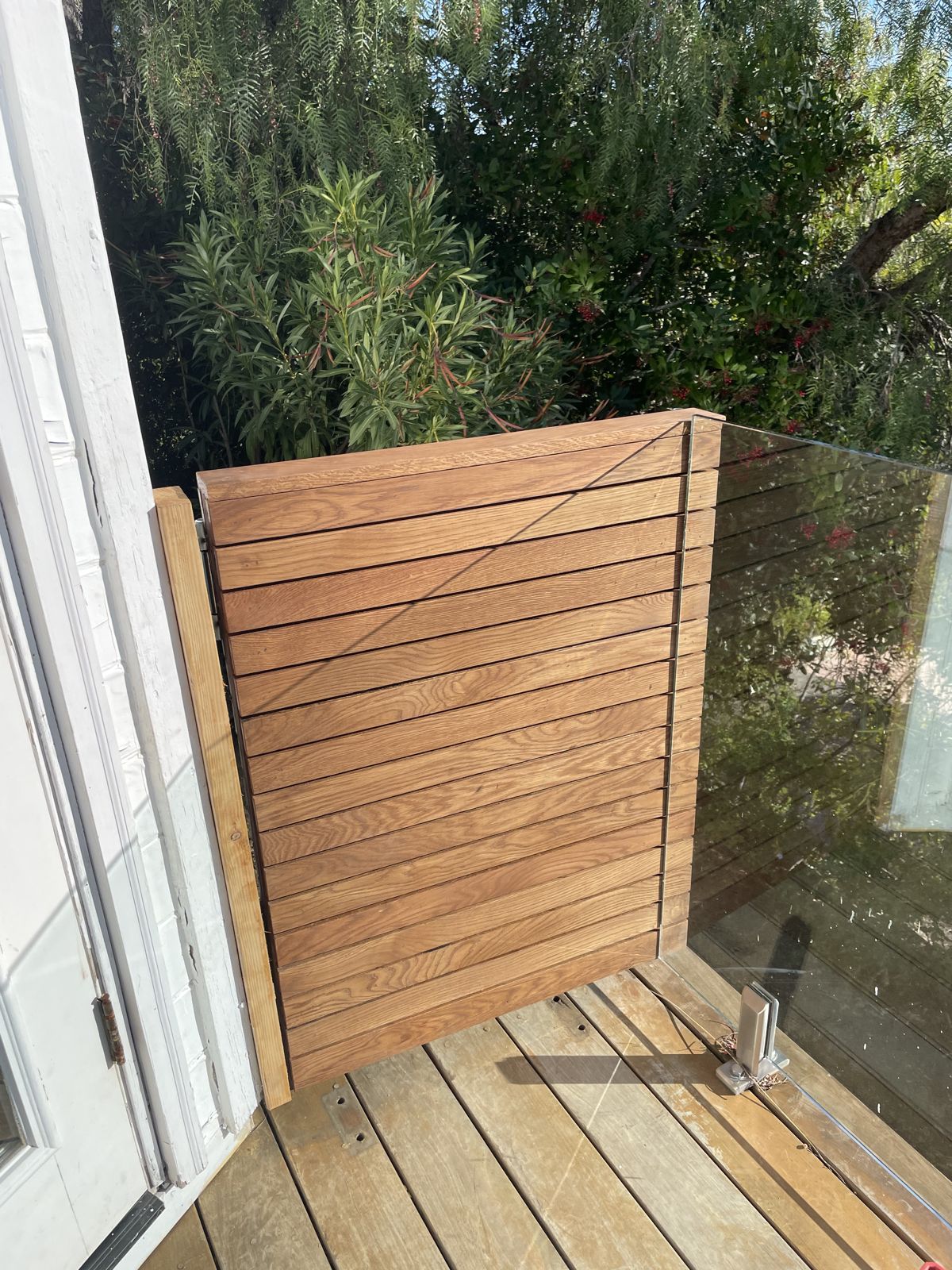 White oak gate closed against the wall