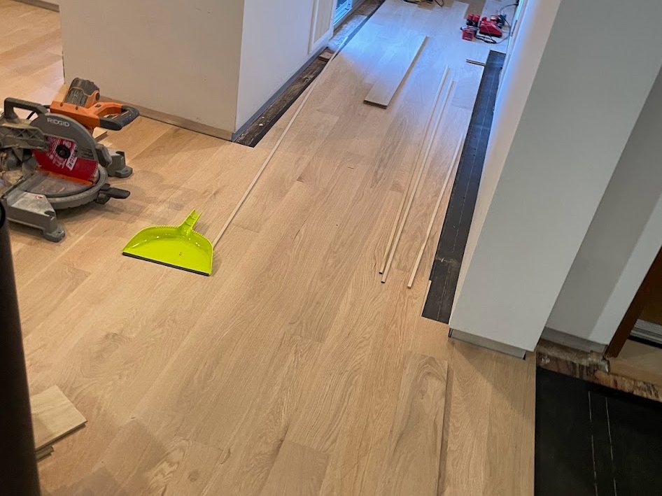 Saw set up on site, boards being cut to fit at a doorway