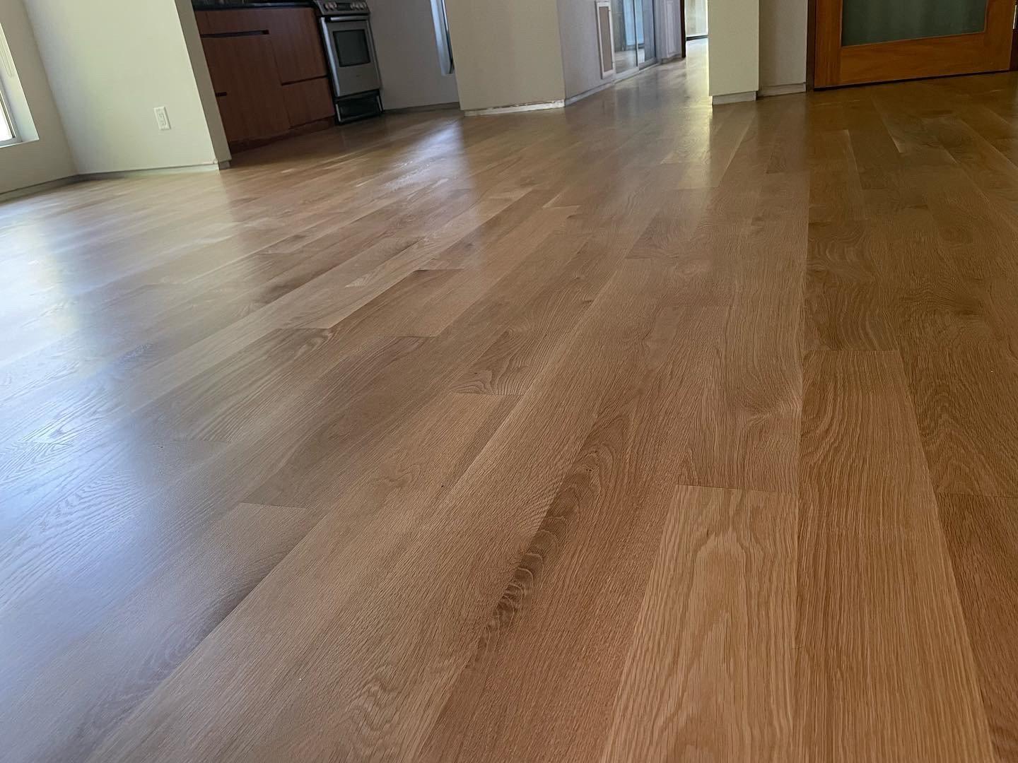 Finished hardwood floor through an open living space