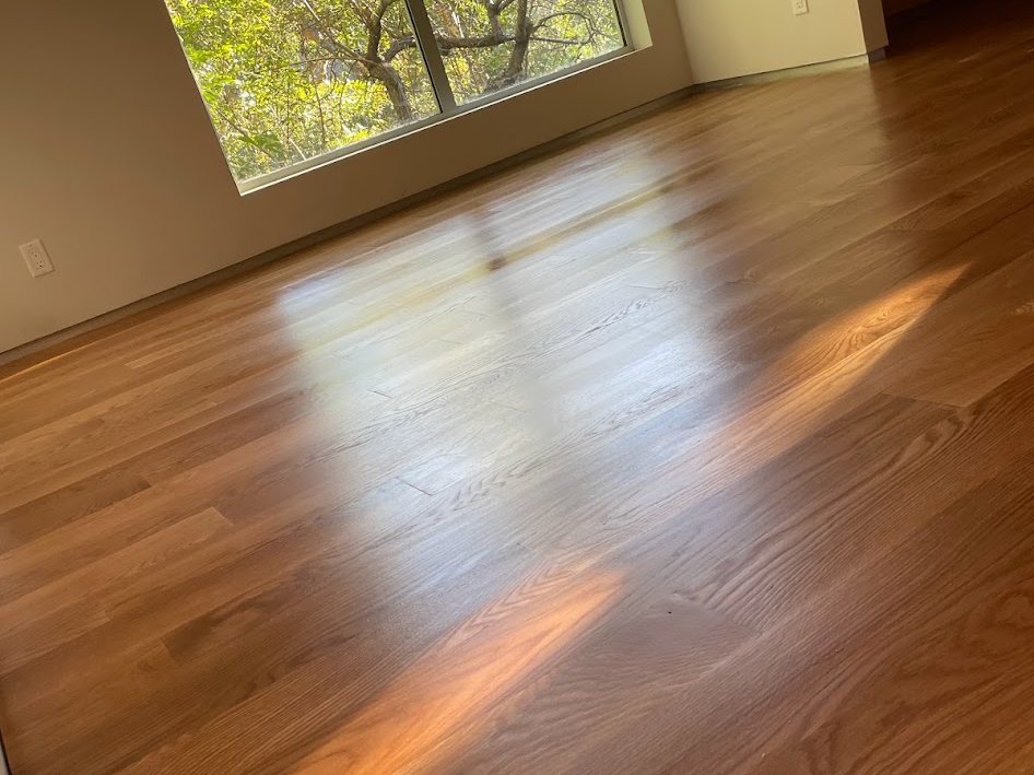 Finished floor with daylight raking across the boards