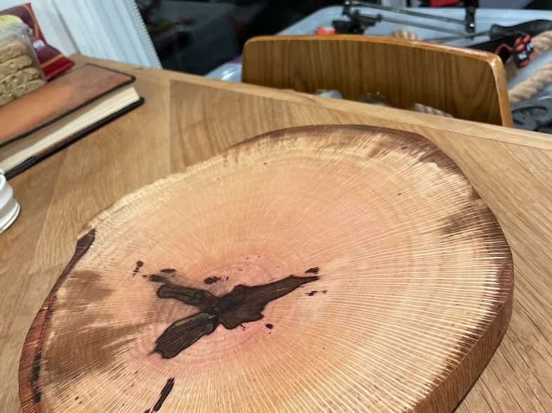 Round live-edge slice with a dark natural inclusion