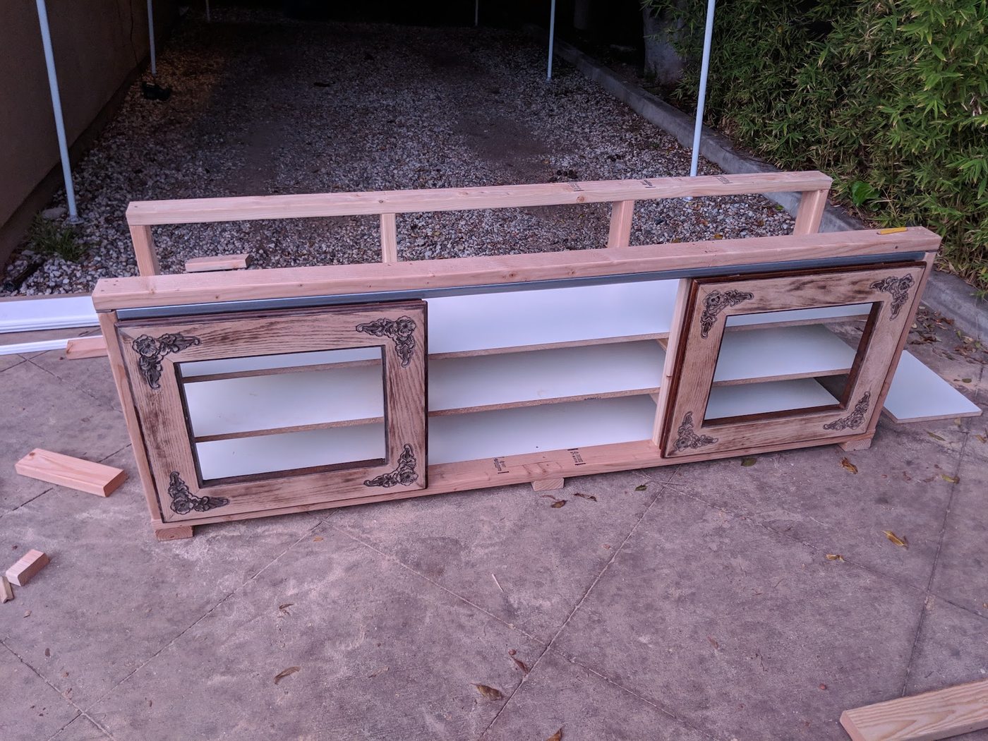 The console assembled and primed, shelving and openings visible